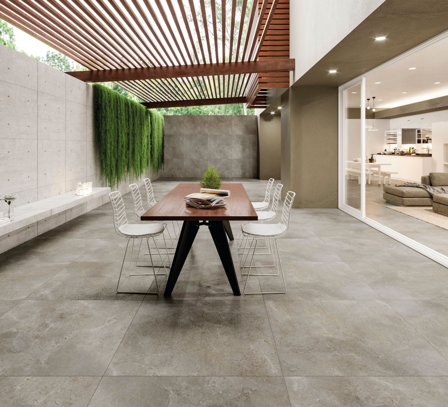 Moderne graue Outdoor-Fliesen auf einer stilvollen Terrasse mit Pergola.