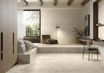 Großformatige Fliesen in hellem Beige für ein stilvolles Schlafzimmer.